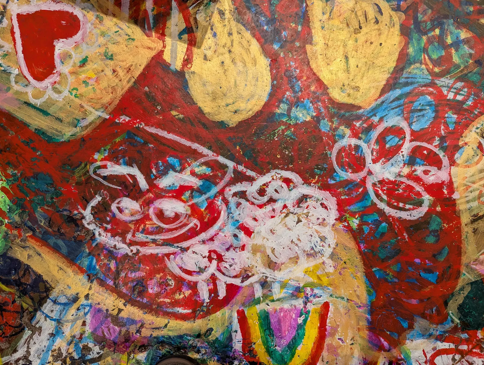 Wax crayon on floor.